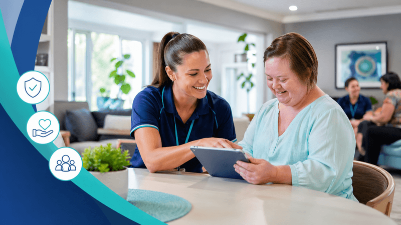 NDIS support worker helping a participant with digital provider compliance